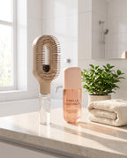 Brumelle Vanilla Coconut Scent Mist beside the Brumelle Hydrating Brush in beige on a bathroom counter