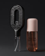 The Complete Ritual Set: Brumelle Hydrating Brush in black standing beside the Vanilla Coconut Scent Mist on a dark background