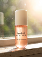 Brumelle Hydrating Scent Mist, Vanilla Coconut, backlit on a sunlit windowsill